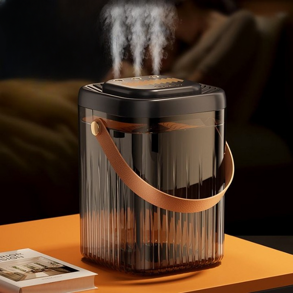 Compact USB Mini Humidifier emitting steam on a stylish orange table, perfect for personal spaces and enhancing air moisture.