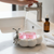 Cute Cloud Shape Soap Drain Tray with bunny design, holding pink soap, by sink.