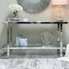Double Tier Silver Console Table styled with decorative items and a mirror, perfect for modern interiors.