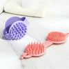 Double-sided Pet Grooming Brush in purple and pink, designed for effective pet grooming and bathing.