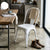 Modern Iron Dining Chair for Apartment Villa Garden Use displayed in a cozy kitchen setting with a wooden table and accessories.