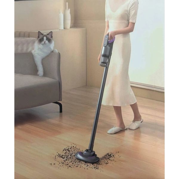 Mite Remover 2 in 1 Cordless Vacuum Cleaner in use on hardwood floor with cat nearby.