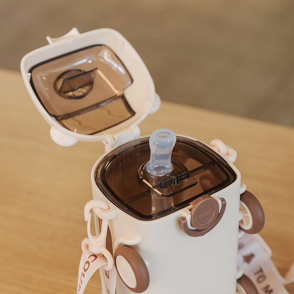 Fun Cartoon 500 ml Kids Water Bottle with a flip-top lid and silicone spout for easy sipping.