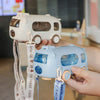 Fun Cartoon 500 ml Kids Water Bottle in bus design being held by a child, promoting hydration for kids.