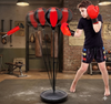 Height Adjustable Freestanding Reflex Bag Kit in use by a boy improving hand-eye coordination and fitness.