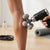 Person using a 5-Ball Handheld Massager on their leg for targeted relief and relaxation.