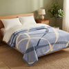 Soft Printed Blanket displayed on a neatly made bed, showcasing stylish patterns for cozy home decor.