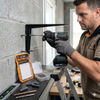 Man using 6-Piece Masonry Screw and Wall Plug Fixing Set to mount a bracket on a wall.