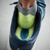 Cushioned Comfort Insoles inside a running shoe, showcasing textured surface and cushioned support for enhanced comfort.
