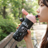 600ml Kids Character Water Bottle in playful character design being used outdoors.