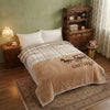Soft Printed Blanket displayed on a cozy bed, featuring a decorative carriage pattern and soft texture.