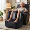 Elderly woman using an Electric Foot and Calf Massager for relaxation in a cozy living room setting.