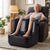 Elderly woman using an Electric Foot and Calf Massager for relaxation in a cozy living room setting.