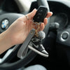 Mini 3D Shoe Keychain attached to car keys held in hand, showcasing unique design and keychain accessories.
