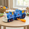 Cogs & Conductor Construction Train Set featuring a blue toy train with a screwdriver on a table.