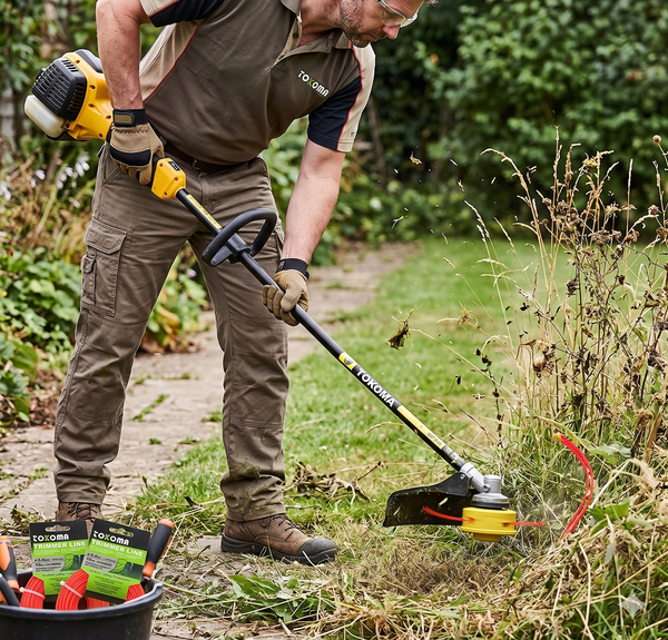 Person using Heavy-Duty Trimmer Line 10m for garden maintenance and weed clearing.