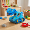 Dino Vehicle Construction Toy in bright blue on a play table with colorful toys around it, perfect for imaginative play.