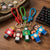 Pixel Character Light-Up Keychain featuring colorful pixel-style characters attached to keychains.