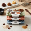 6 Cup Silicone Swirl Muffin and Cupcake Baking Tray with decorative muffins and baking ingredients on the table.
