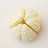 Playful Produce Cutting Set toy piece resembling a cross-section of a brain for imaginative play.