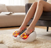 Electric Foot Massager in use with feet positioned for a relaxing experience at home, featuring red heating lights.