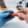 Person inserting a Rechargeable Cylindrical Battery Cell into a device, demonstrating its compatibility in electronics.