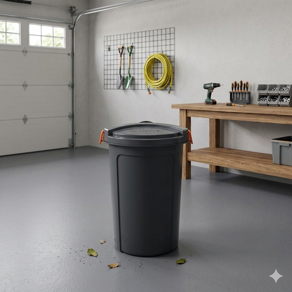 23L Heavy Duty Plastic Bin with Lid in a garage setting for organizing household waste and supplies.