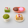 Pretend Bakery Treats Play Set featuring colorful desserts including macarons and cake-style pieces.