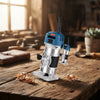 Craft Pro Compact Wood Router placed on a wooden table surrounded by woodworking tools and shavings.