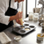 Baking with Non-Stick 6-Cup Shell-Shaped Muffin Pan, chef filling molds with batter.