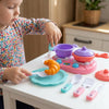 Child playing with the Pretend Play Breakfast Kitchen Set, using utensils and colorful play food on a table.
