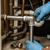 Plumber installing a 304 Stainless Steel 90 Degree Elbow Pipe Fitting in a pipe system.