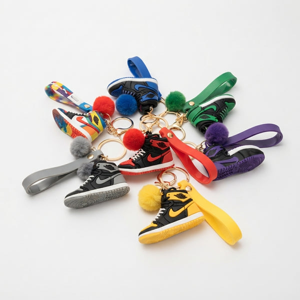Colorful Mini 3D Shoe Keychain collection featuring various designs and pom-poms for decorative key rings.