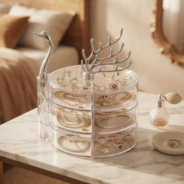 3-Tier Clear Swan Jewellery Organizer with swan handle displayed on a marble surface, showcasing jewelry neatly arranged.