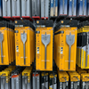 35mm Quick-Change Tri-Point Flat Wood Drill Bit and 32mm wood drill bits displayed on a store shelf.