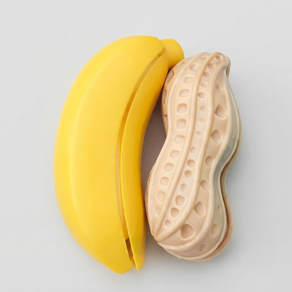 Playful Produce Cutting Set featuring a playful yellow banana and a beige peanut toy for imaginative food play.