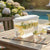 3.5L Beverage Dispenser with Tap and Lid serving lemon and mint water by a poolside on a sunny day.