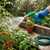 Adjustable High Pressure Garden Water Gun watering vibrant plants in a garden