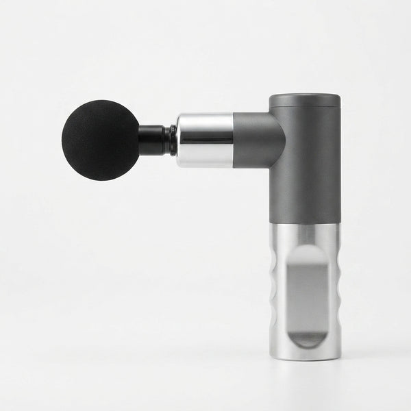 Portable Mini Massage Gun in gray and silver with a detachable massage attachment.