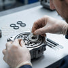 A technician assembling a Sealing Ring Set on machinery with various sizes of sealing rings in the background.