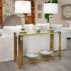 Glass Gold Decorative Console Table with elegant gold rods, clear glass shelf, and tabletop lamps in a modern living room.