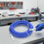 20M High Pressure Airless Sprayer Hose on a workbench with tools in the background.