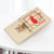 Heavy Duty Wooden Snap Mousetrap on a white table capturing effective rodent control.