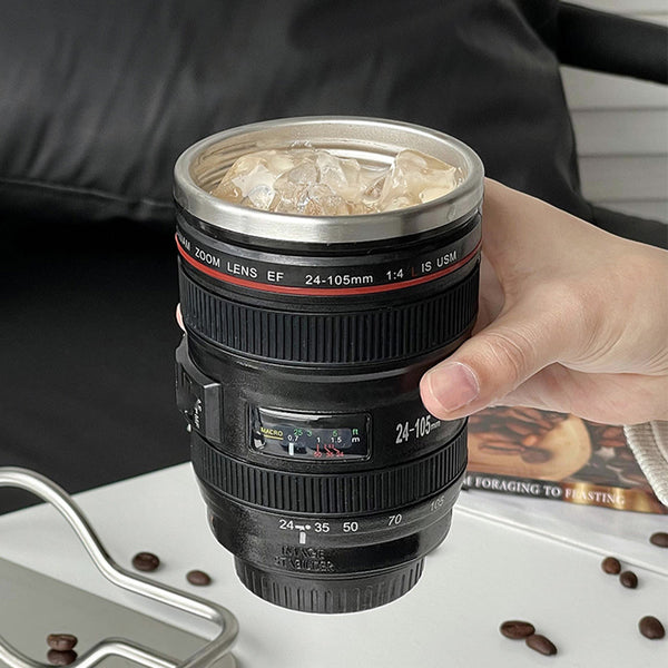Camera Lens Travel Mug with Lid filled with iced coffee, resembling an actual camera lens.