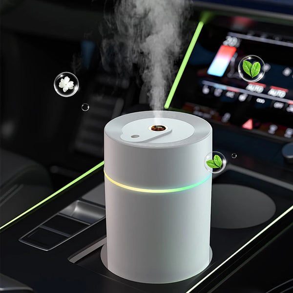 The Mini 420ml USB Air Humidifier producing mist in a car interior with ambient lighting.