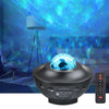 Star Night Light Projector with Bluetooth Speaker illuminating a starry sky in a cozy room.
