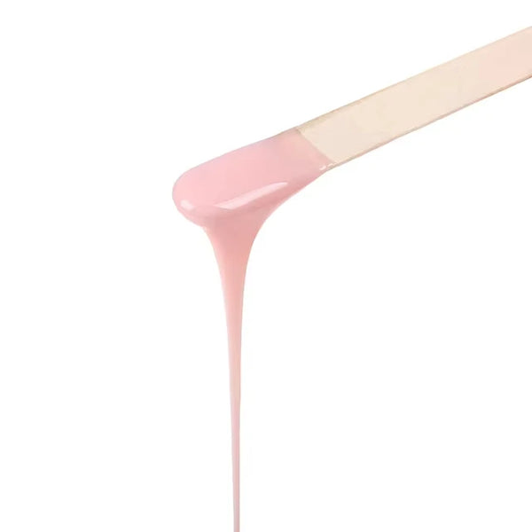 Painless Strawberry Hard Wax Block melting on a spatula, showcasing its creamy consistency for easy hair removal.