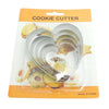 Classic 5 Piece Stainless Steel Cookie Cutter Set featuring heart shapes on packaging with cookies in the background.