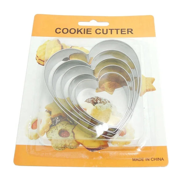 Classic 5 Piece Stainless Steel Cookie Cutter Set featuring heart shapes on packaging with cookies in the background.