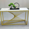 Nordic Golden Marble Console Table with geometric golden base and decorative items on a white marble top.
